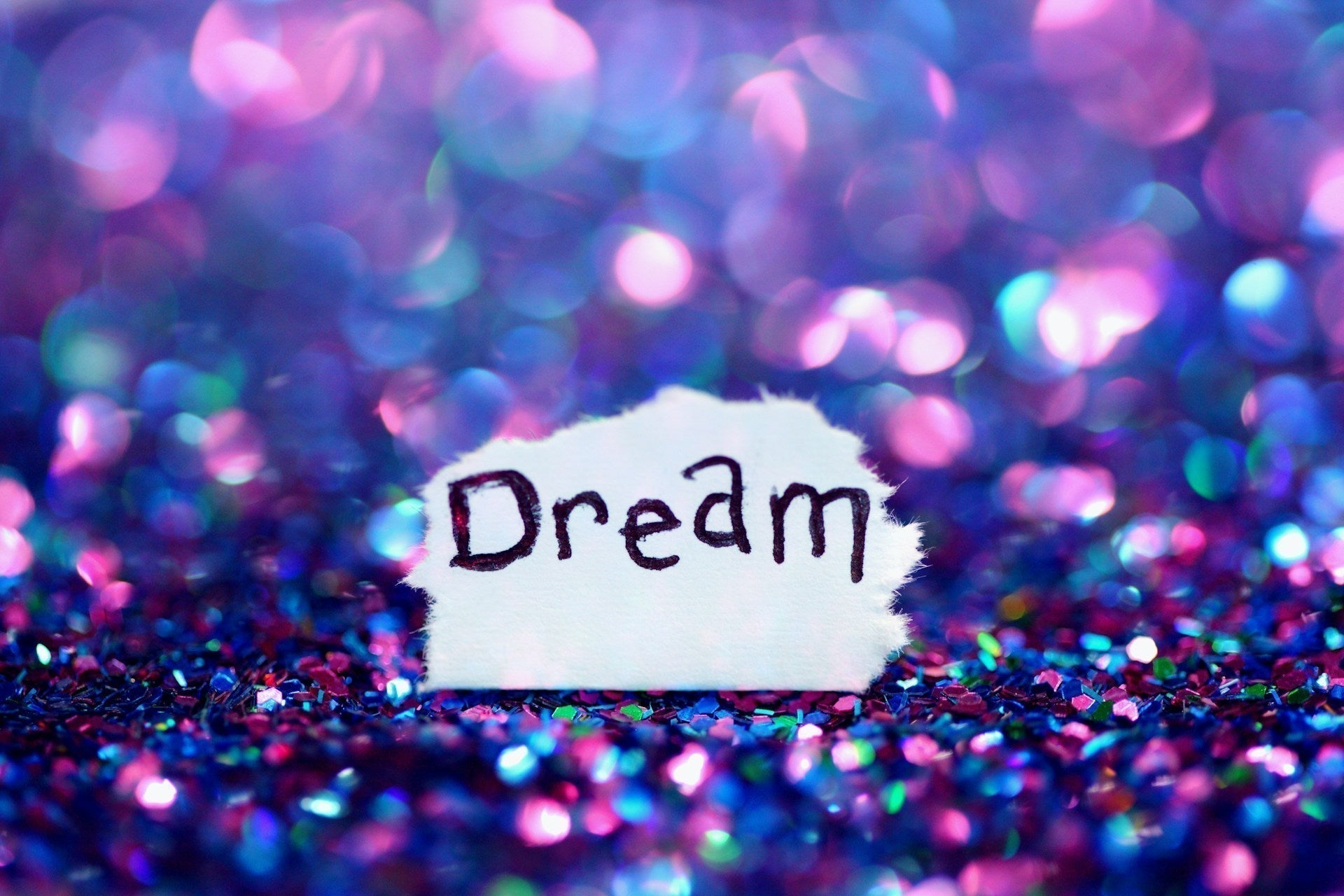 sparkles surround the word "dream"